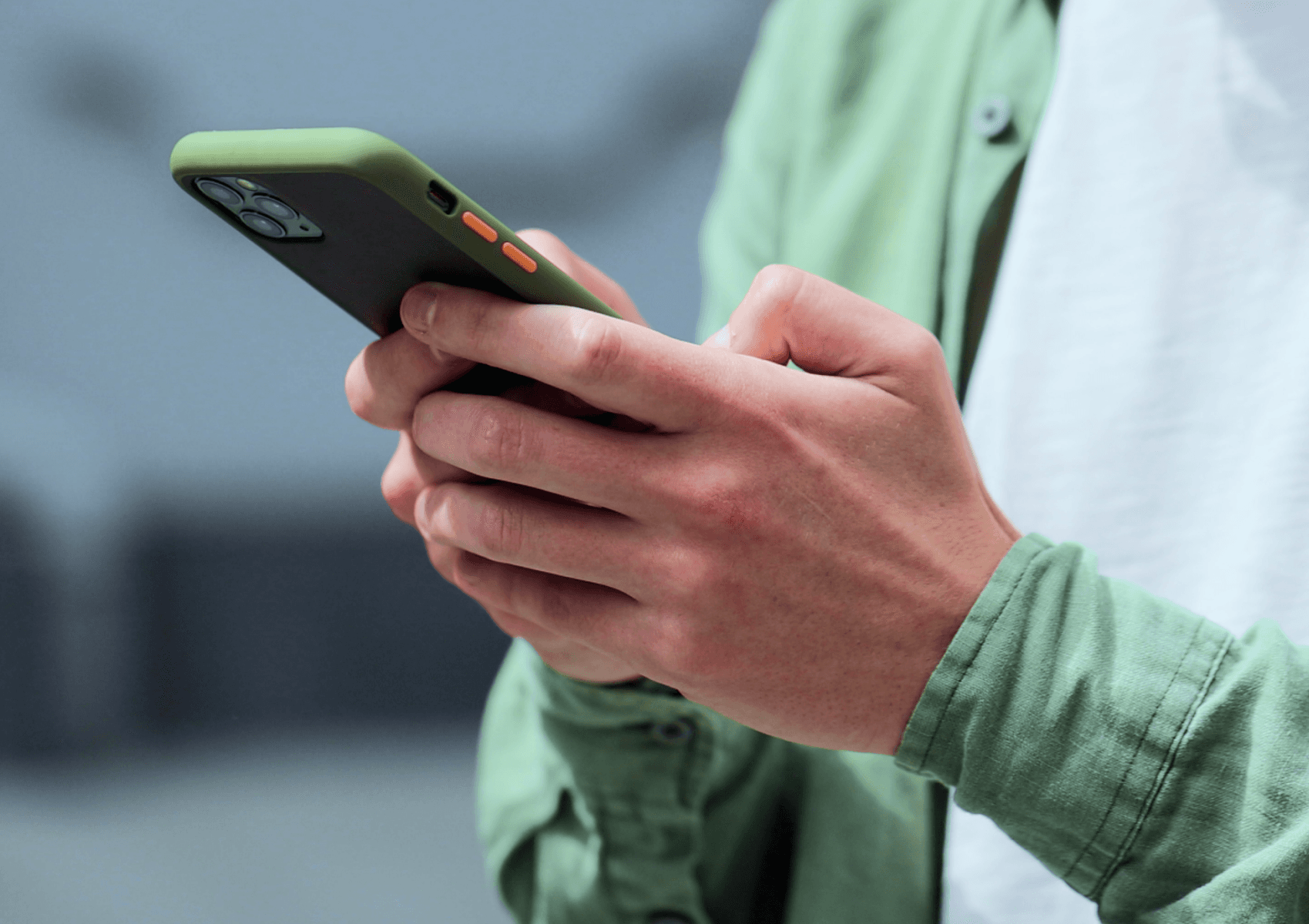 a person holding a mobile phone in their hands, only the hands are visible, push notifications hot to guide illustration