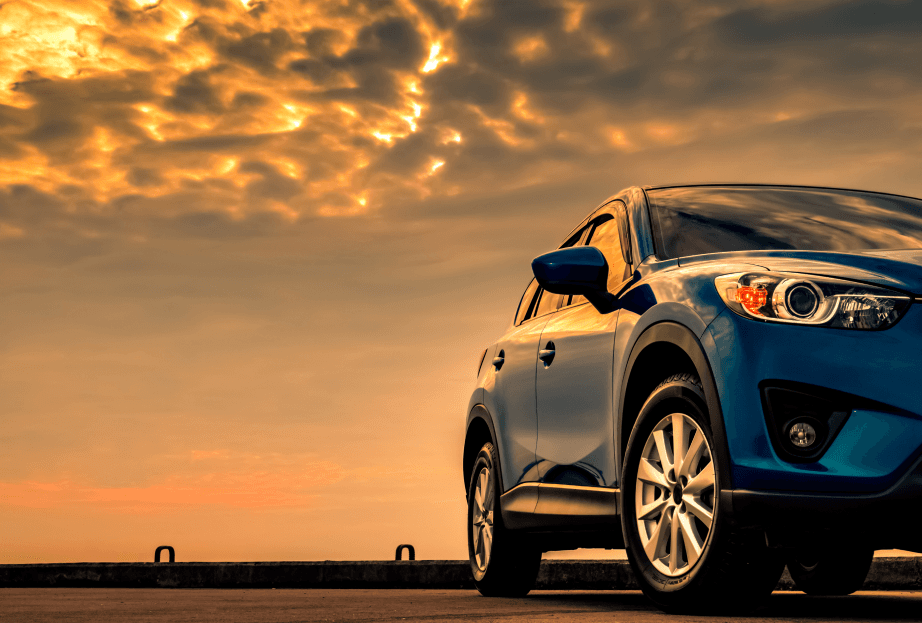 Sports car at sunset to showcase mobitouch's case study of Rentalcars integration automation with Rent a Car Direct.