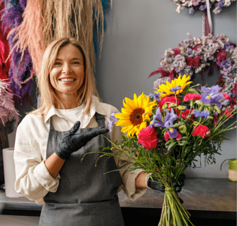 Photo of a woman, flower shop SME owner for Oryva AI Claude web app case study