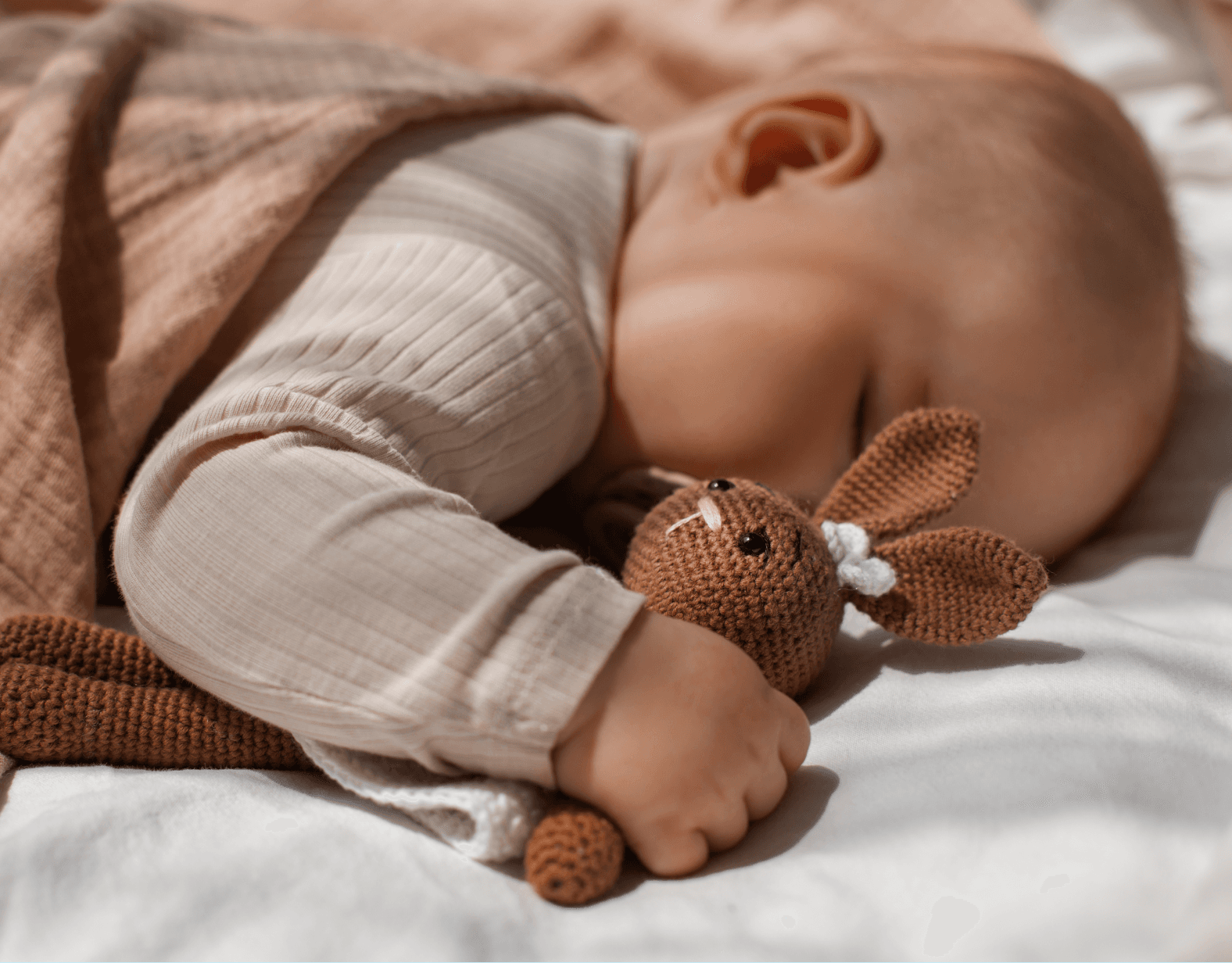 A baby sleeping soundly and undisturbed